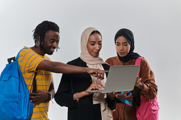 A group of students, including an African American student and two hijab-wearing women, stand...