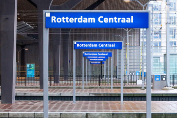 Blue nameplates on the platform of Rotterdam Centraal station