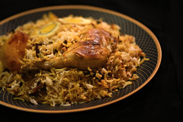 Chicken biryani Spicy Indian Malabar biryani Hyderabadi biryani, Dum Biriyani pulao  Kerala India Sri Lanka Pakistan basmati rice mixed rice dish with Chiken curry Ramadan Kareem, Eid