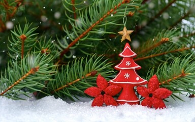 red wooden Christmas tree decorations lie on the table between the fir branches