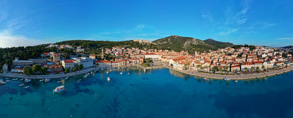 Aerial view of Hvar city in the Island of Hvar in Croatia. Famous for having an incredible nightlife scene, alongside its renowned historic town center and natural landscapes. - obrazy, fototapety, plakaty