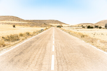 VP-17 paved road on a summer landscape leaving Alforque, province of Zaragoza, Aragon, Spain