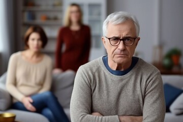 
Senior caucasian spouses misunderstanding each other, experiencing crisis in relationship, offended wife looks disappointedly at camera, husband sits in defocus on background. Quarrel, marital crisis - obrazy, fototapety, plakaty