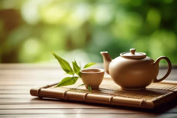  Delicious Japanese tea - hot teapot and cups on a bamboo mat © Ирина Курмаева