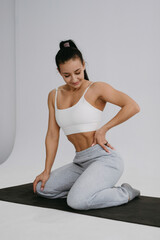 Fototapeta premium athletic girl, woman fitness trainer, group training, gym, strong woman, crossfit, bodybuilding, bikini fitness, workout, athletic figure, exercise