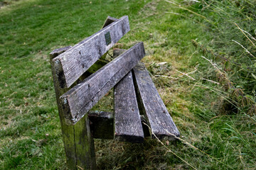 Broken collapsed wooden bench seat along the Kennet and Avon canal Devizes Wiltshire UK - obrazy, fototapety, plakaty