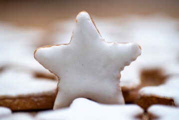 Cinnamon cookies in star shape and heart shape with white cinnamon icing