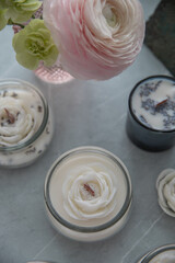 Candles with lavender and flowers in the interior