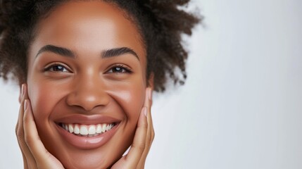 Radiant Young Woman With a Joyful Smile Holding Her Cheeks