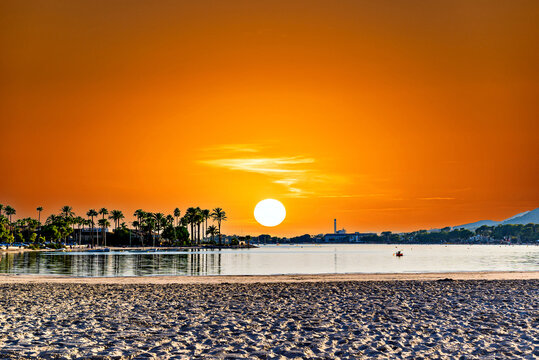 Sunset views of Alcudia Beach, next to the port. Balearic Islands, Spain	