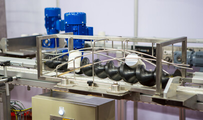 Food cans on belt conveyor. Food processing. Food industry.	