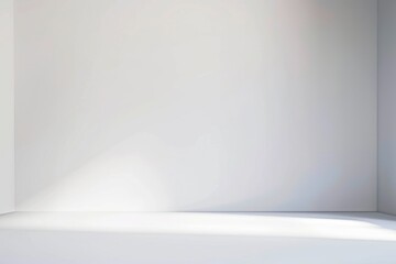 A simple and minimalistic empty room with a white wall and floor. Suitable for various design...