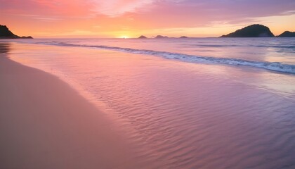 A vertical image of a tide on the beach over the sand during a colorful sunset with the islands - obrazy, fototapety, plakaty