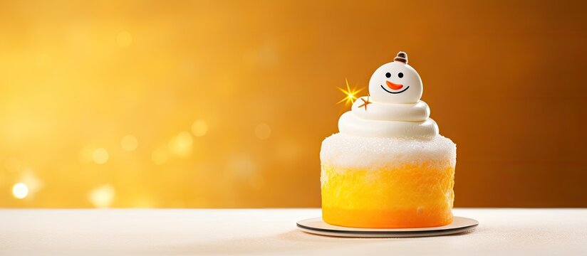 White meringue snowman on cake in front of yellow glass pane. Creative Banner. Copyspace image