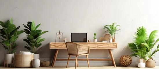  Stylish and boho home interior of open work space with wooden desk chair lamp laptop and white shelf Design and elegant personal accessories Botany and minimalistic home decor with plants © HN Works