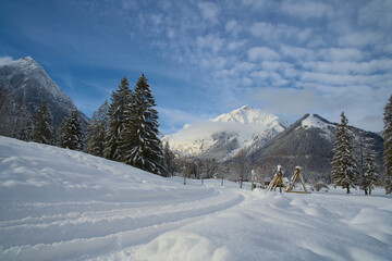 Fototapeta na wymiar Winter hiking trail in a snow-covered landscape in Pertisau at Lake Achensee.