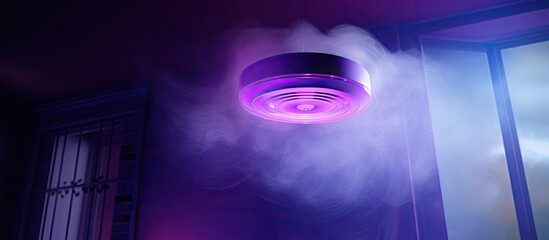 Smoke detector in a house Close up of a smoke detector covered with purple light. Creative Banner. Copyspace image - obrazy, fototapety, plakaty