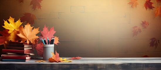 school supplies on the table autumn still life with textbooks and yellow maple leaves. Creative Banner. Copyspace image - obrazy, fototapety, plakaty
