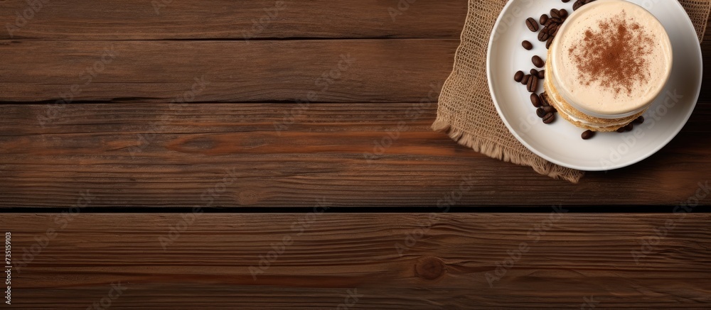 Poster tiramisu dessert and coffee on wooden table top view with copy space. creative banner. copyspace ima