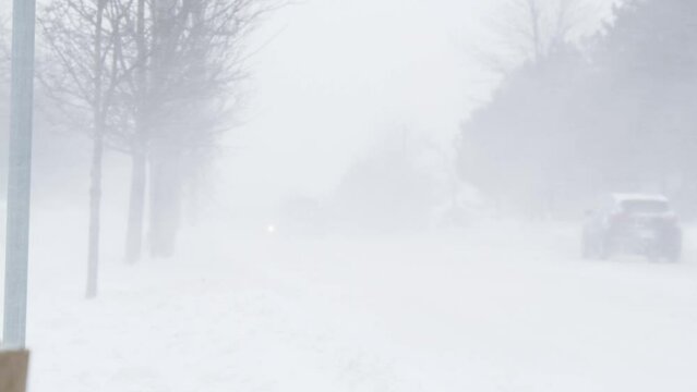 Snowstorm, poor visibility, slippery roads and a lot of traffic in the Canadian city of Dartmouth. heavy snowfall with hurricane winds and heavy traffic.