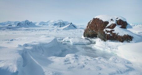 Antarctic snow mountain range winter landscape. Fly over the untouched wilderness of Antarctica....