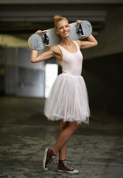 Portrait, ballet and happy woman with skateboard and sneakers for edgy fashion, trendy outfit and hipster style. Parking lot, aesthetic and ballerina smile for dance hobby, sports and skating skill