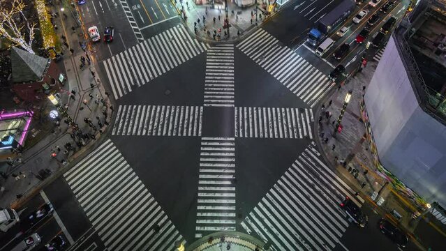 Timelapse view of busy intersection at night in Ginza, a popular upscale shopping area of Tokyo, Japan.