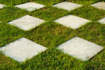 Green lawns with bricks pathways.