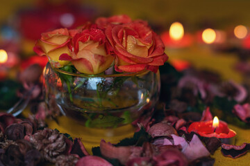 Bouquet of roses, candles and gifts, card for February 14, St. Valentine, March 8, wedding, birthday, mother's day, blurred background, bokeh.