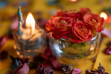 Bouquet of roses, candles and gifts, card for February 14, St. Valentine, March 8, wedding, birthday, mother's day, blurred background, bokeh.