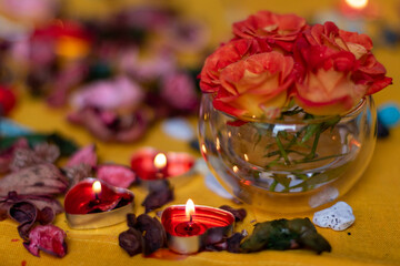 Bouquet of roses, candles and gifts, card for February 14, St. Valentine, March 8, wedding, birthday, mother's day, blurred background, bokeh.