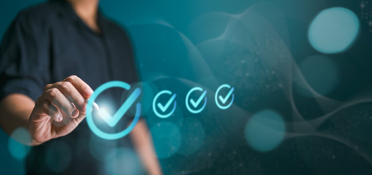 Business performance checklist, male businessman use pen and pencil doing evaluate online survey questionnaires, filling out digital forms, and take assessment checklists with blue background