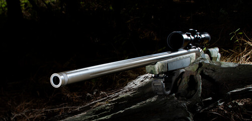 Modern inline muzzleloader rifle in a forrest
