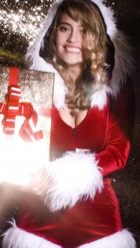 Woman in cute santa claus costume for disco shoot in vertical