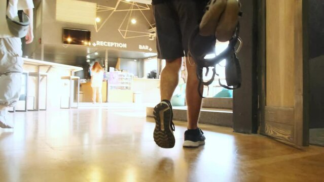 Woman and man with equipment walks toward reception. Best friends signal beginning of risky workout session in fitness club