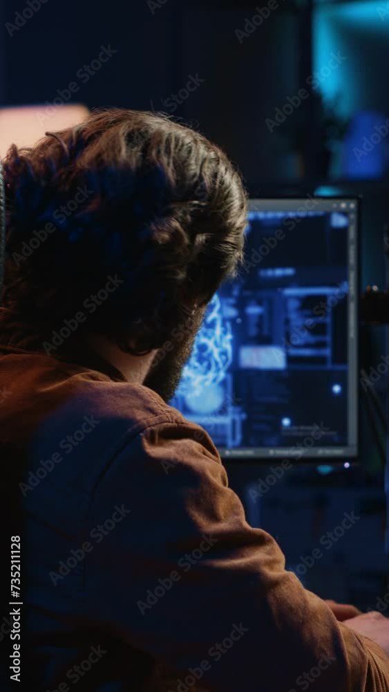 Poster experienced developer uses computer to update artificial intelligence neural networks, writing code 