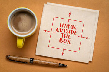 think outside the box - inspirational concept - handwriting on a napkin with coffee, business, education and personal development