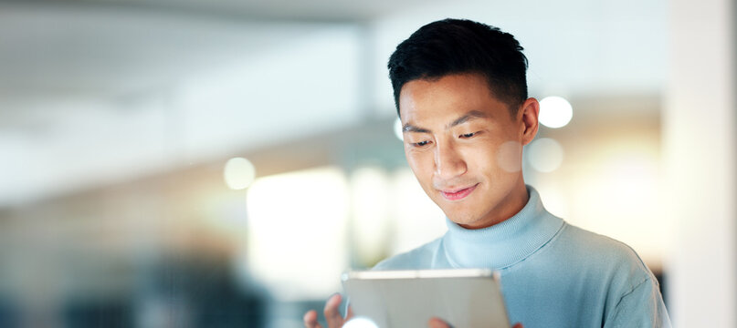 Asian man with tablet, smile and scroll, thinking and reading email, review or article at startup. Internet, research and happy businessman with digital app for with networking, social media or web.