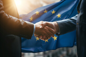 Successful businessmen handshaking after good deal. Business partnership meeting concept. Flag of European Union on a background. - obrazy, fototapety, plakaty