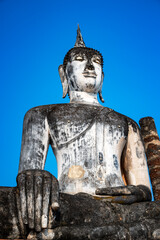 Closeup view of Buddha statue in Wat Mahathat in Sukhothai, Thailand - 735217337