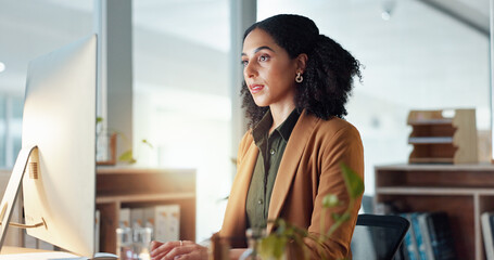 Businesswoman at desk with computer, typing email for research report for article at digital agency. Internet, writing and woman at tech startup with online review, networking or website feedback.