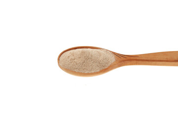 Psyllium (Ispaghula) Husk in wooden spoon, close-up. Psyllium coarse flour. Dietary Fiber Food Supplement. White background, copy space, design element
