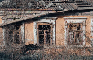 Fototapeta premium empty windows of a damaged house in Ukraine