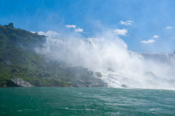 Fototapeta premium Clouds of splashes and falling water from Niagara Falls, Niagara State Park
