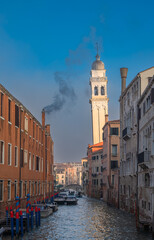 Rio dei Greci canal and the leaning bell tower of San Giorgio dei Greci Church in Venice, Italy. - 735231990