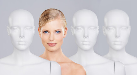 Woman, mannequins and portrait for identity, skincare and individuality on studio background....