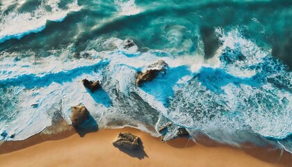 Fototapeta na wymiar Aerial view of seascape. Blue ocean water with waves. Beautiful sandy beach. Rocky coastline.