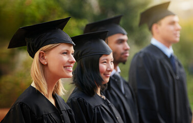 Smile, graduation and woman student in line with friends at outdoor ceremony for college or...