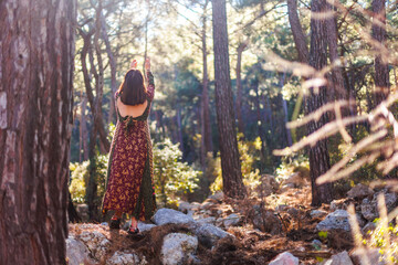 young and beautiful dancer practicing intently among natural landscapes. A young and beautiful girl...