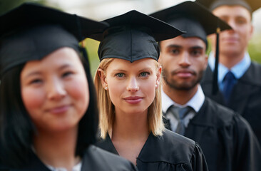 Portrait, graduation and woman student in row with friends for university or college ceremony...